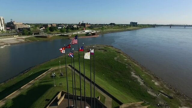 Waving Flags in Mud Island River Park, Memphis, Tennessee. Hernando de Soto Bridge and Mississippi River in Background