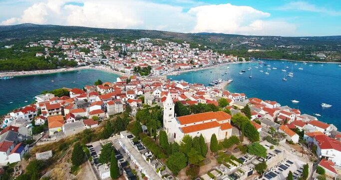 Flight over an old church located on top of a mountain overlooking the Adriatic Sea in Primo&scaron;ten, Croatia