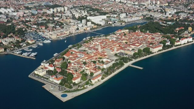 Aerial shot of Zadar old town, famous tourist attraction in Croatia. Waterfront aerial summer view, Dalmatia region of Croatia. Drone