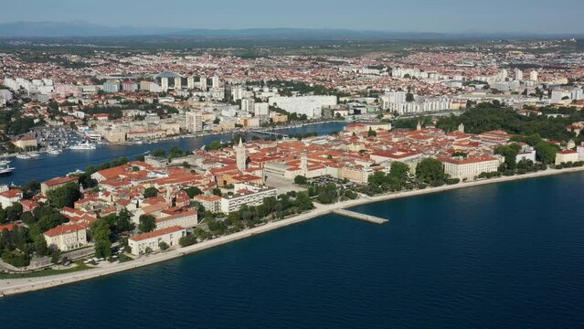 Aerial shot of Zadar old town, famous tourist attraction in Croatia. Waterfront aerial summer view, Dalmatia region of Croatia. Drone