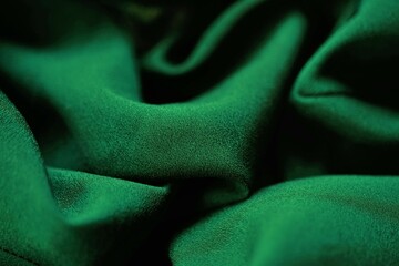 Delicate dark green fabric, green material chiffon waves