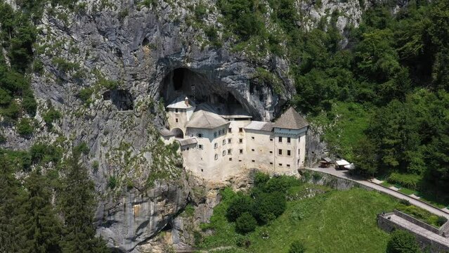 Predjama Castle in Slovenia, Europe. Renaissance castle built within a cave mouth in south central Slovenia, in the historical region of Inner Carniola. It is located in the village of Predjama. Drone