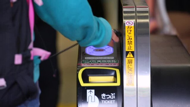 Shinjuku Ticket Gates in Tokyo Metro. Pasmo Card or Suica Card. People Taping Card to go Through the Gate. Tokyo Underground Metro Network