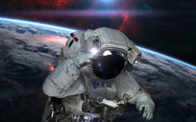 Astronaut in outer space orbiting planet Earth. Solar system. Science fiction. Elements of this image furnished by NASA