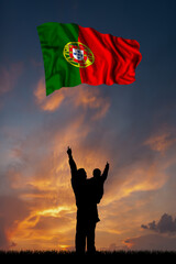 Father with son and the flag of Portugal