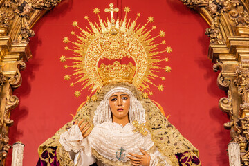 Fototapeta na wymiar Image of the Virgen de la Esperanza de Triana inside the Capilla de los Marineros (Chapel of the Sailors) in the Triana neighborhood, Seville, Andalusia, Spain 