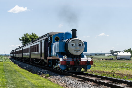 Ronks, Pennsylvania, June 19, 2022- Close-up of Thomas the Tank Engine chugs down the track heading for the Strasburg Train Station in Lancaster County, Pa.
