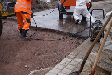 Asphalting of a new road on a construction site housing construc
