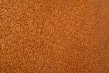 A brown leather texture that is textured and has a small pattern.