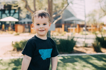 little toddler boy looking at the camera wearing a montana t-shirt