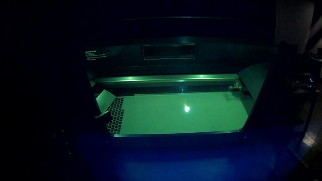 3D printer printing object from metal powder in working chamber by sintering metal powder under laser. Melting metal powder. SLM. Selective laser melting technology.Working 3d printer for metal.