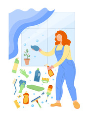 A woman washing a window with a lot of cleaning products.