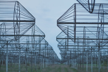 Radio astronomy observatory radio telescope construction in the fields in early spring in cloudy weather, T-shaped radio telescope in the Kharkiv region