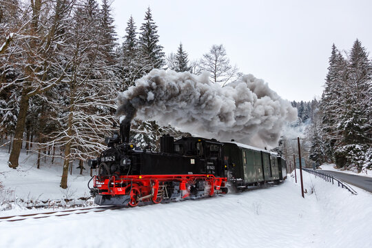 Pressnitztalbahn steam train locomotive railway in winter in Jöhstadt, Germany