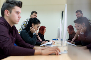 Young people in programming school.Students Learning In A Programing Class