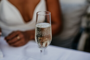 wedding details essentials white wedding dress bride in white robe getting ready for wedding day rings sandals heels sea sunset seaside