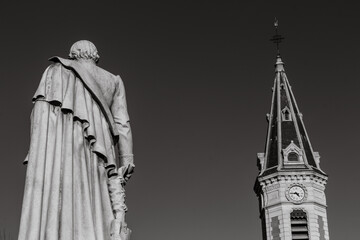 Gap, Hautes Alpes, France : Statue of the Baron Ladoucette (19th century) and the tower of the Eglise des Cordeliers (Church of the Cordeliers).	