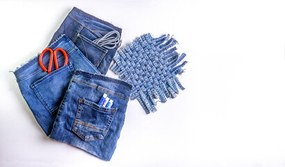Old jeans ready to upcycling. Concept of things reuse and natural resources preserving.	