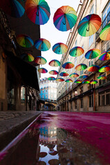 Obraz na płótnie Canvas R. Nova do Carvalho Purple street with umbrellas. Chiado district, party district, in Lisbon, Portugal. empty people, beautiful old street with historical houses
