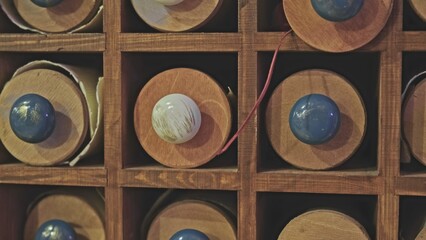 Fototapeta premium Historical Manuscript Antique Ancient Parchment Scrolls Stored in Wooden Tubes Archived in University Library