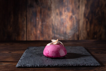 Pink sweet pudding. Pink cake on the table.