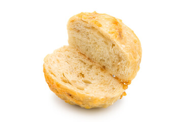 Freshly baked cheese bun cut in half isolated on white background.