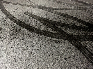Snowy trail: tire imprints on the freshly fallen snow on road