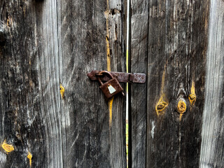 Capturing the nostalgia of an old wooden woor with an aged lock
