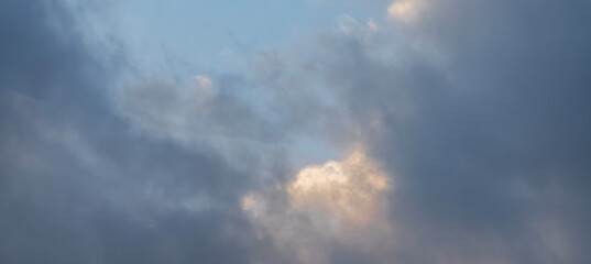 Beautiful orange clouds on the  blue sunset sky. Sky clouds background.