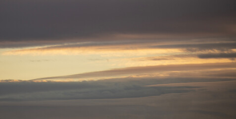 Fototapeta na wymiar Beautiful bright orange sunset sky with dramatic clouds. Sunset sky background.