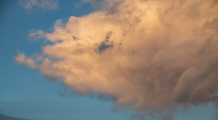 Naklejka na ściany i meble Beautiful orange clouds on the blue sunset sky. Sky clouds background. 