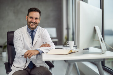 Portrait of doctor talking to online patient at clinic office giving online consultation for domestic health treatment