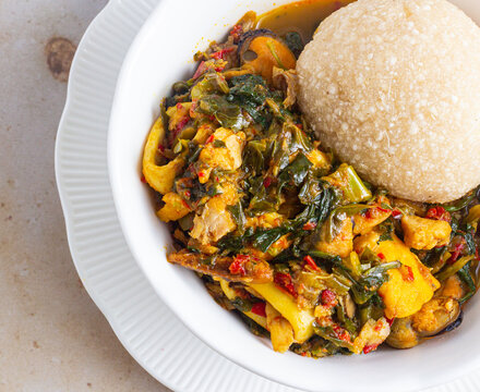 Eba with efo riro (stewed leafy greens). 