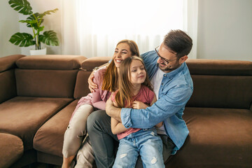 Smiling family enjoying together at home