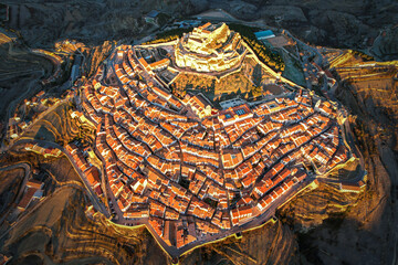 Aerial view at sunrise above the beautiful village of Morella in the mountains of Castell&oacute;n