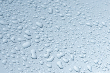 water drops on gray and blue surface