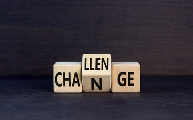 Challenge and change symbol. Concept word Challenge Change on wooden cubes. Beautiful black table...