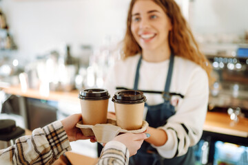 Young  barista girl with coffee. Small business owner, food and drink industry concept