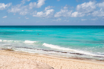 Varadero beach in Cuba in the year 2023. Blue sea, clear sky and many tourists on the beach.
