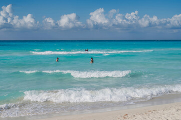 Fototapeta na wymiar Varadero beach in Cuba in the year 2023. Blue sea, clear sky and many tourists on the beach.