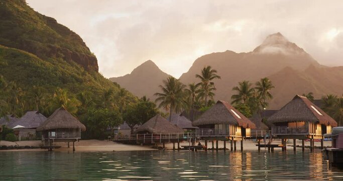 Travel vacation luxury resort hotel overwater bungalows on paradise beach. Romantic holidays retreat or honeymoon destination. French Polynesia. Nobody, SLOW MOTION
