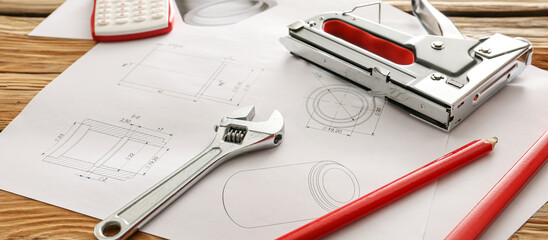 Workplace of engineer with drawings and supplies