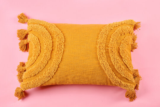 Stylish decorative pillow on pink background