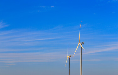 Windmill in the blue sky background