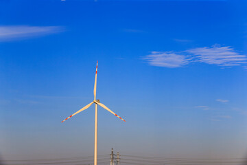Windmill in the blue sky background