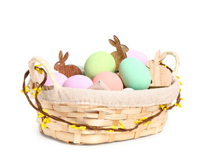 Wicker basket with painted Easter eggs isolated on white background