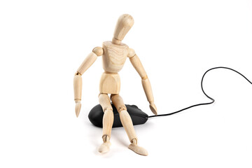 A wooden artist's mannequin sitting on a computer keyboard, suggesting or parodying AI artificial intelligence, isolated on white