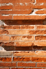 Old red brick wall elements. Brick texture wall