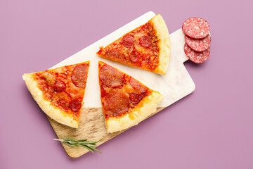 Board with slices of delicious pepperoni pizza on lilac background