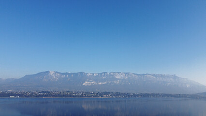 View over a lake. Blue sky and mountain.